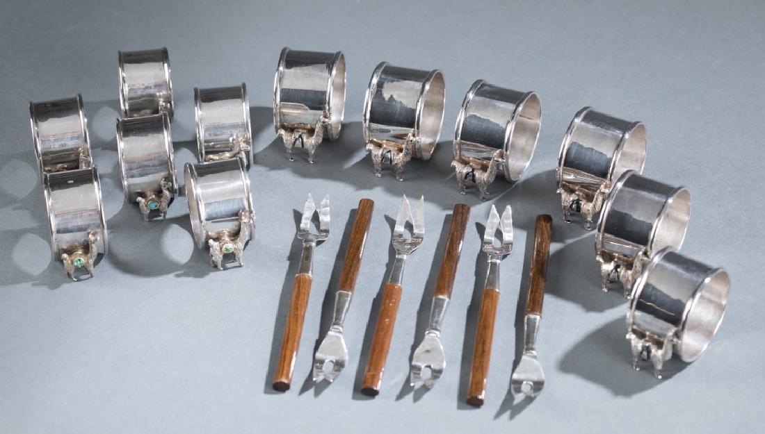 12 Sterling Silver Llama napkin holders & 6 forks: A group of 12 Sterling Silver Llama napkin holders & 6 olive forks. 8.04 troy oz.