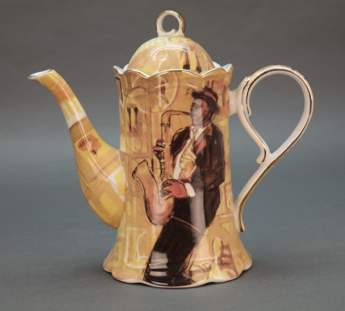 Black Americana coffee pot with saxophonist. (1 of 5)