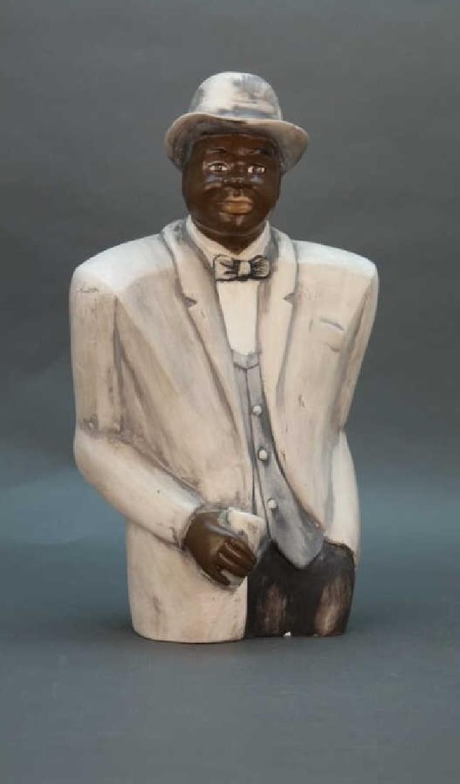 Black Americana statuette: Man in suit bowtie, hat: Black Americana statuette of a man in a light gray suit, bowtie, and hat. Plaster. Height: 15 in.