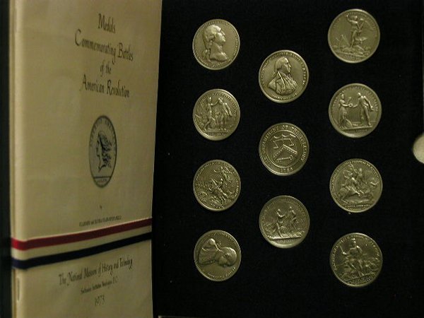 Folder of 11 coins commemorating Battle: Folder of 11 coins commemorating Battle of the American Revolution (1973) 2 extra John Paul Jones and Nathan Green