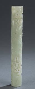 Chinese jade incense holder.: A Chinese jade incense holder. Qing dynasty. Celadon jade. Carved in relief and openwork design. Depicting immortal and his attendant walking in mountain landscape with pine tree and hidden pagodas. M