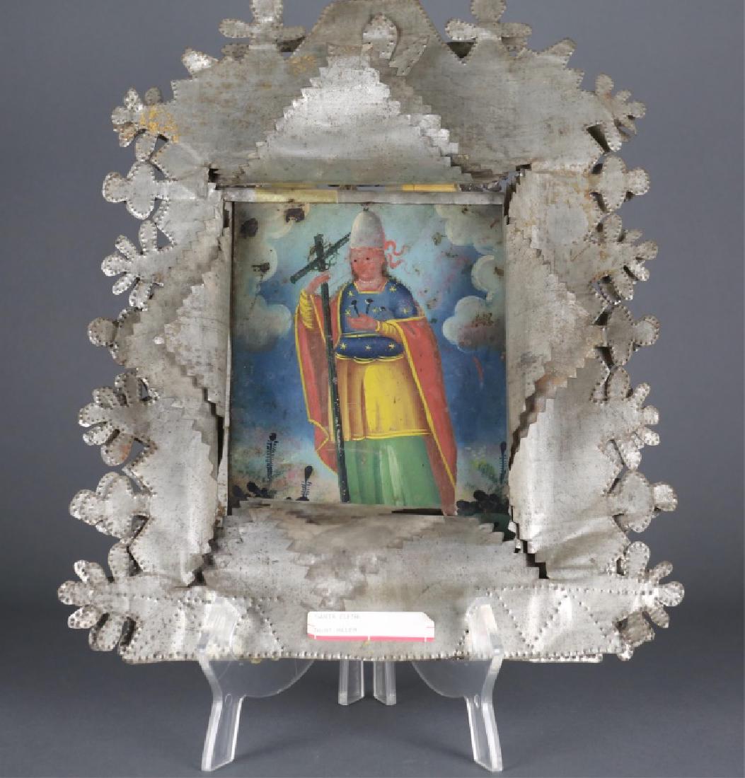 Saint Elena, Tin Retablo, 20th century.: A Saint Elena Tin Retablo. 20th century. Elaborate cut and punched tin frame. Saint Elena, in polychromatic robes, standing in front of blue sky and cloud background. Oil on tin. 9" x 7". Frame: 18 1/