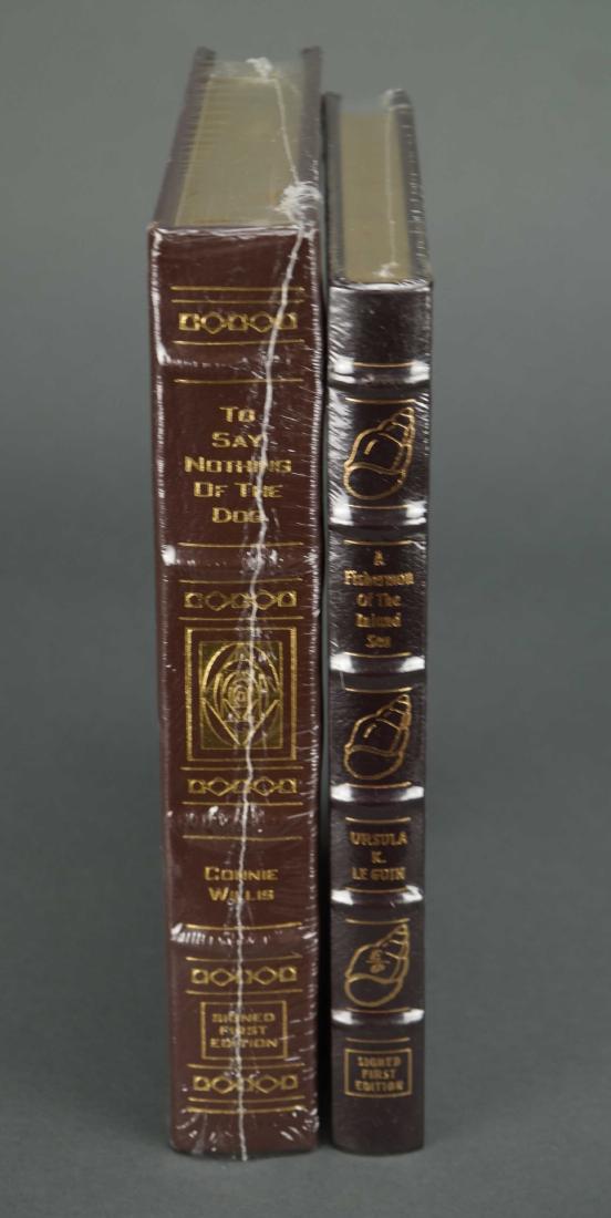 2 vols Easton Press. Sgd. Inc: Le Guin. Willis.: [Easton Press/Signed] 2 Titles. Easton Press. 8vo. Each in gilt-decorated full leather, all edges gilt. Includes: (1) Ursula K. Le Guin. A Fisherman of the Inland sea. 1995. (2) Connie Willis. To Say 