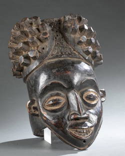 Bamileke helmet mask. 20th century.: A Bamileke wooden helmet mask. 20th century. Bamileke. Cameroon._x000D_Provenance: Inventory and Collection from the Estate of Merton D. Simpson.