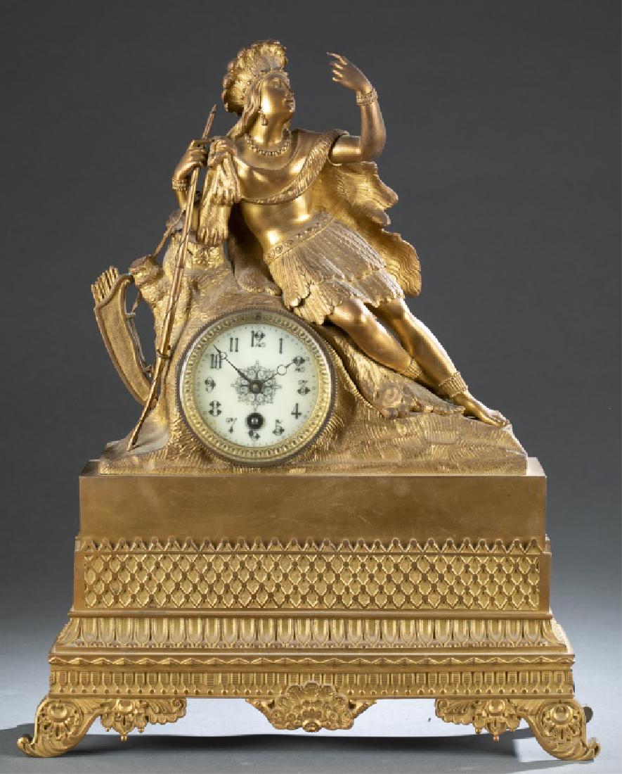 French Ormolu Figural Mantel Clock, 19th century.: A French Ormolu Figural Mantel Clock. 19th century. Porcelain dial with Arabic numerals. Allegorical figure of 'Africa' above rectangular base. 17 1/4."