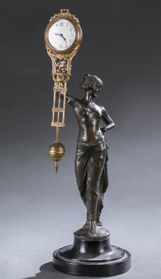 Franz Iffland, Nude Female Bronze, Swinger Clock.: A Franz Iffland (German, 1862-1935) Nude Female Swinger Clock. 19th/20th century. Nude Female. Bronze. Signed on base "F. Iffland." Clock: 9 3/4" x 2 1/2." Bronze: 9 3/4" x 4 3/4."