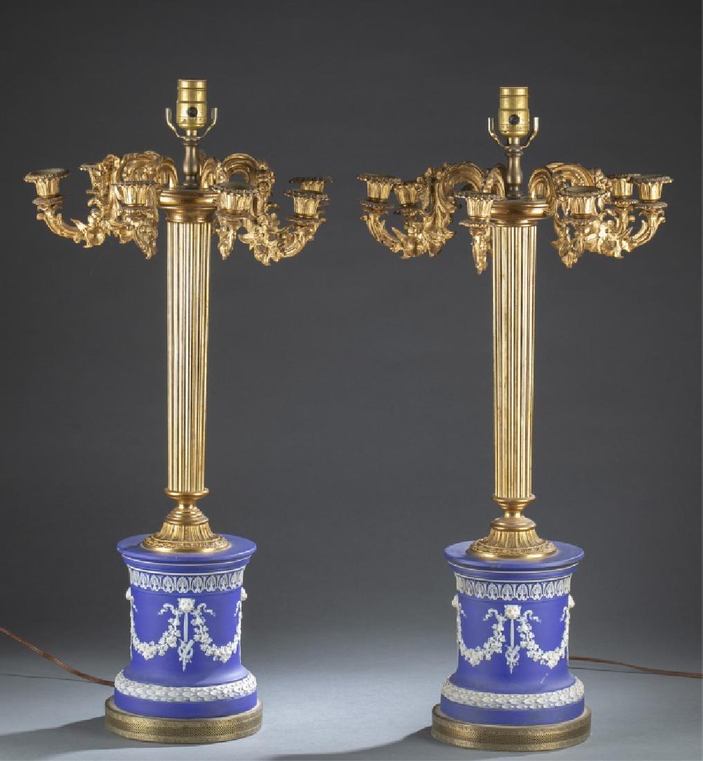 Pair of English Ormolu Jasper Candelabras, 19th c.: A pair of two English Ormolu mounted Jasper seven-light Candelabras. 19th century. Scrolled candelarms fluted holders on a fluted column and spreading circular foot above drum-form Jasperware based de