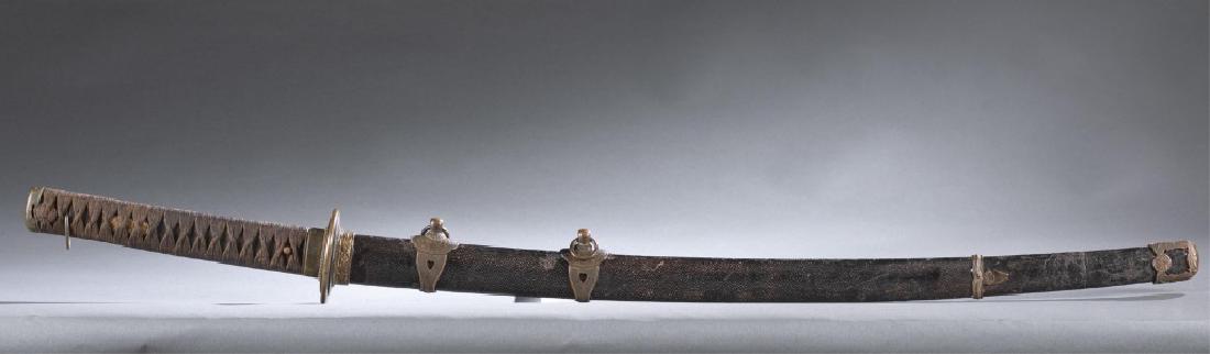 Japanese WWII Kai Gunto sword, Ishido Mitsunobu.: A Japanese WWII Kai Gunto sword. Samegawa/ rayskin Saya; cotton wrapped Tsuka; Rising Sun Tsuba; Sakura motif decorated Fuchi, Menuki and other ornaments; with single-edged slightly curved blade. Naka