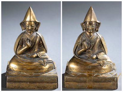 2 Chinese Tibetan gilt seated Buddha statues.: A group of two Chinese Tibetan gilt seated Buddha statues. 18th/19th century. Gilt bronze. Seated Lama in robe, seated on rectangular throne, with his right hand in Vitarka/ Argument Mudra, left hand