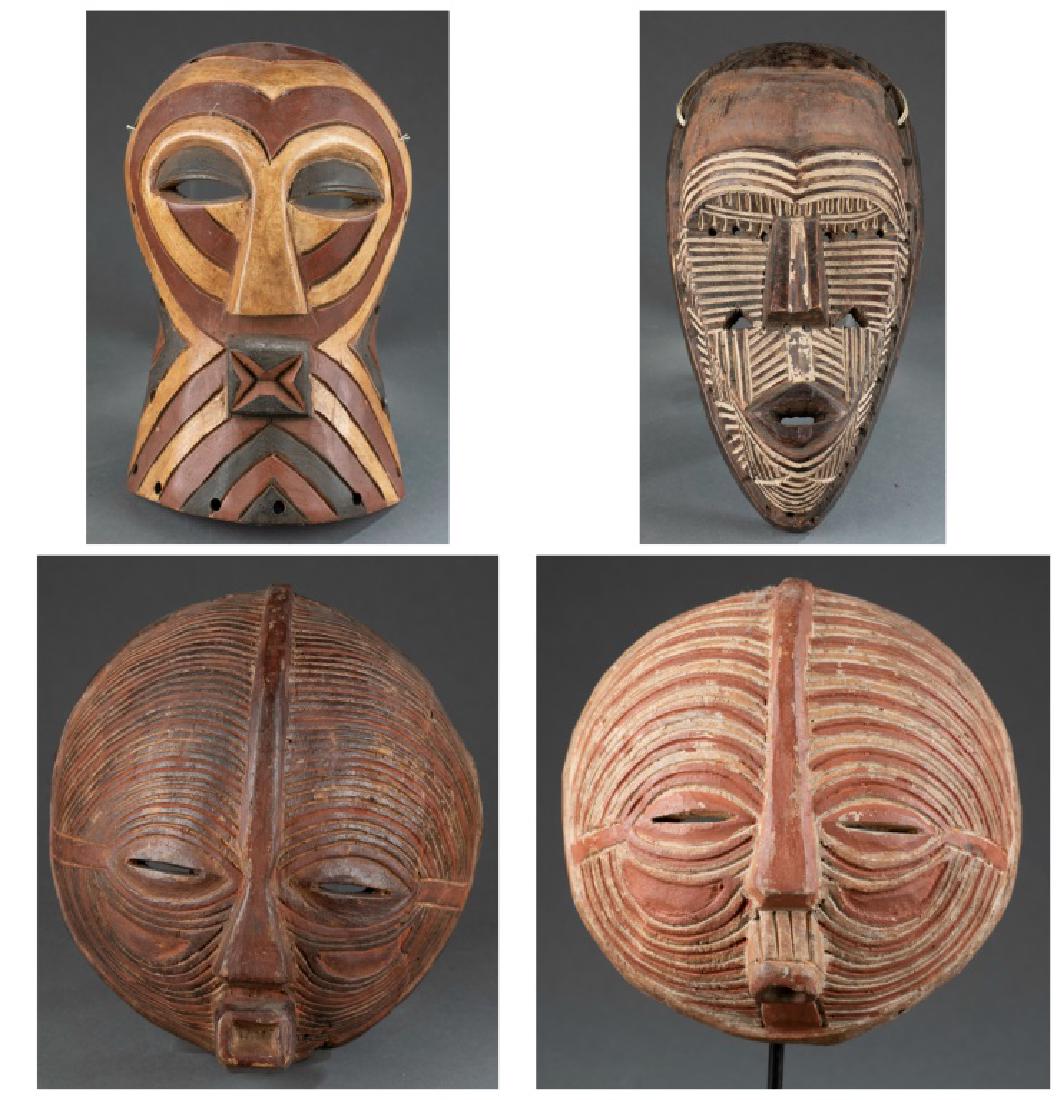 4 Congo masks. 20th century.: A group of four Central African masks. 20th century. ++ Tetela style. DRC. 13 1/2" x 7". ++ Luba style. DRC. 9 3/4" x 9 1/2". ++ Luba style. DRC. 11 1/2" x 10 1/2". ++ Songe style. DRC. 11 1/2" x 7 1/