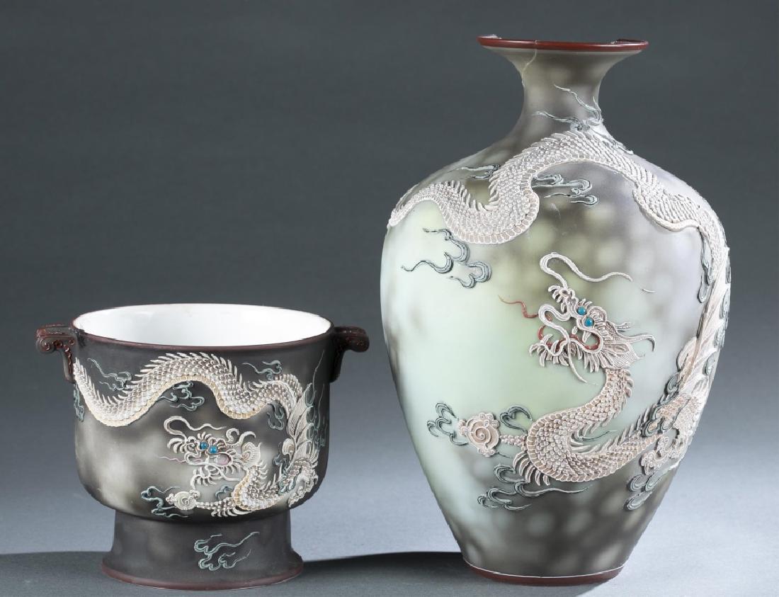 2 Nippon Moriage Dragon pieces, 20th century.: A group of two Morimura brothers Nippon Moriage Dragon pieces. 1911-1921. Japanese. ++ Dragon cache pot with two-handles, decorated with blue-eyed dragon. Marked on bottom "Hand Painted Nippon". 5 1/2