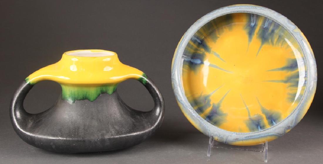 2 Thulin Belgium drip glaze pieces, 20th century.: A group of two Thulin Belgium drip glaze pieces. 20th century. Belgian. Includes one double-handle vase and one low bowl. Marked on bottom. Largest: 2 1/4" x 10 1/2". Smallest: 6 1/4" x 9 3/4".