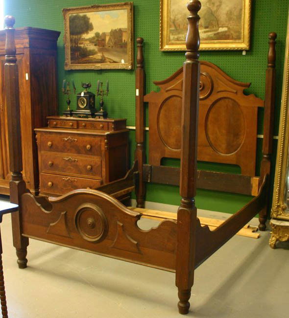 Southern walnut four poster bed. c.1840s-50s.: Southern walnut four poster bed. c.1840s-50s. Each post with ball top and pencil post body, headboard with scroll top with roundel in top center & 2 oval recessed panels. Footboard repeats design of h