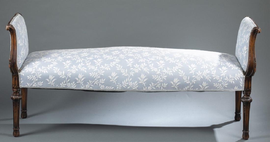 Louis XVI style, directoire bench, circa 1880.: A Louis XVI style directorie bench. Circa 1880. Beech carved with neoclassical floral decoration over fluted legs with serpentine sides. Upholstered in blue and white fabric. 26 1/4" x 58" x 17".