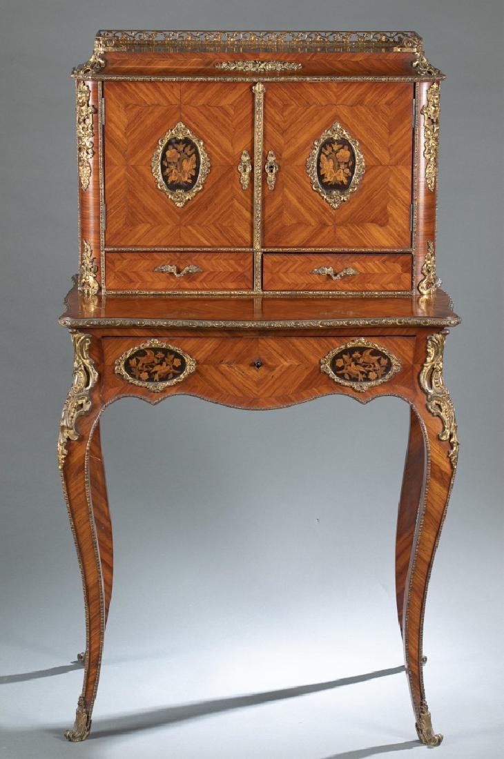 Louis XV style Bonheur Du Jour desk, 19th century.: A Louis XV style Bonheur Du Jour desk. 19th century. Kingwood and tulipwood parquetry and marquetry decoration. Ormolu mounts along top rail, corners, legs, and framing floral marquetry panels. Door p
