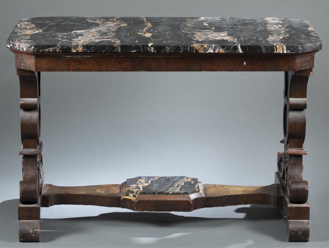 American Empire, marble-top console, c. 1830.: An American empire, Italianate marble-top console table. Circa 1830. Mahogany veneered console table decorated with carved scrolling. Italianate black marble table-top. Wear consistent with age and us