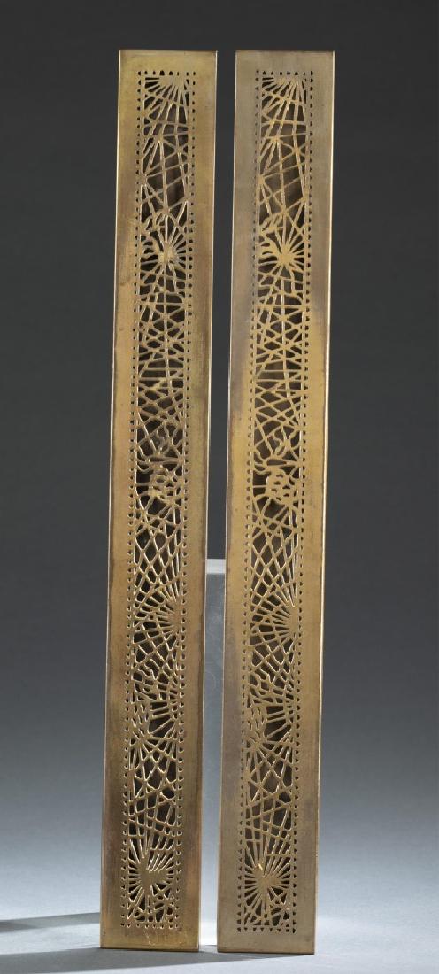 Tiffany Studios, pine needle desk blotter ends.: A pair of Tiffany Studios gilt bronze pine needle blotter ends. Marked on back "Tiffany Studios New York 999". 19" x 2 1/4".