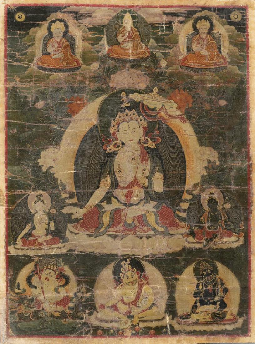 Tibetan Thangka painting of White Tara.: A Tibetan Thangka painting of White Tara. c.18th century. Color pigment on textile. Seated White Taraon lotus throne, holding Parasol in left hand, with halo on the back, flowers behind the halo over