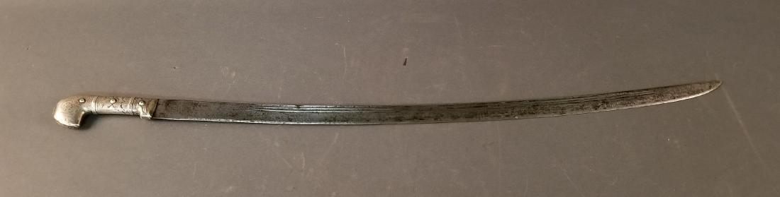 Antique Caucasian Shashka Sword: Antique Caucasian Shashka (Shasqua) Sword ++ Silver hand chased handle ++ Blade has etched towards handle cloud with hand holding sword, sun, & crescent moon with face ++ 35" long