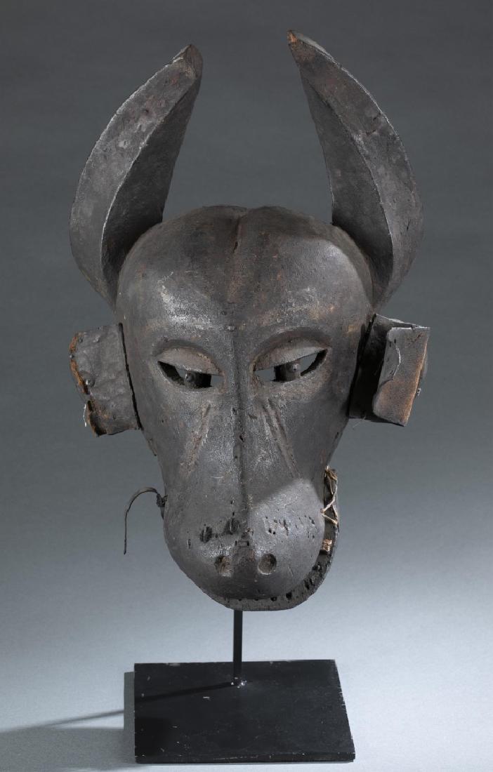 A Cameroon style wooden mask. 20th century. (1 of 6)