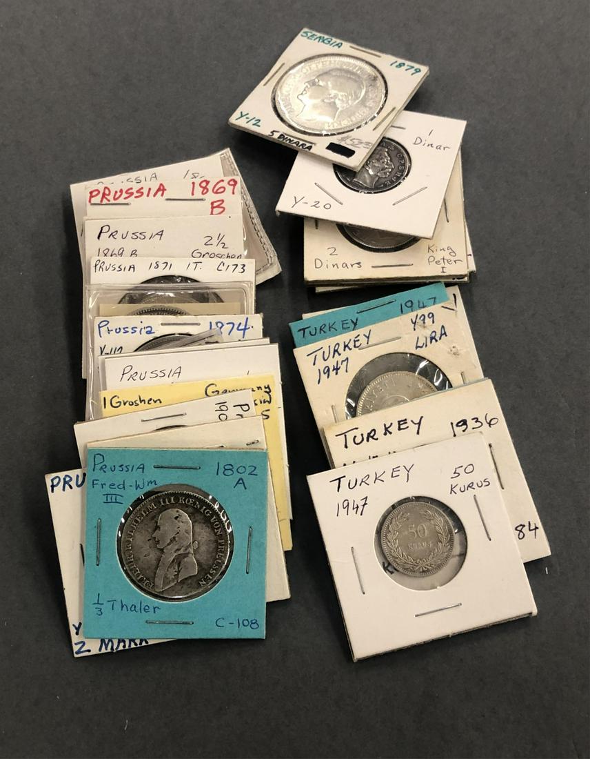 27 World silver coins.: A group of twenty-seven World silver coins. ++ Six Turkish silver coins. ++ Five Serbian silver coins. ++ Sixteen Prussian silver coins. ++ Total weight approx. 11 oz.