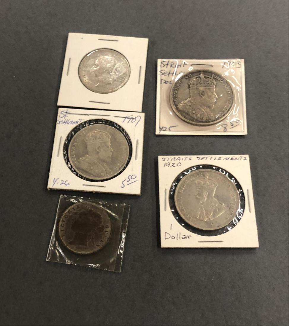5 Straits Settlements coins.: A group of six Straits Settlements coins. ++ Three silver one dollar coins. 1903, 1907, 1903. ++ One 50 cent piece. 1898. ++ One 1 penny with nice toning. 1901.