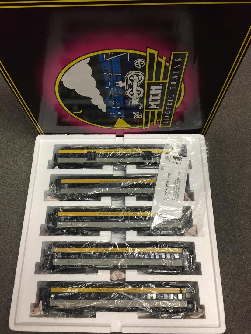 One MTH Scale Madison 5-Car Set. One MTH 4-Car Set: All MTH Electric Trains. All O-Scale. All in original packaging and box. C&O 5-Car 70' ABS Yellow Blue & Grey, Item 20-4028 +++ Amtrak Northwest Corridor 4-Car Amfleet Passenger Set, Item 20-6531.