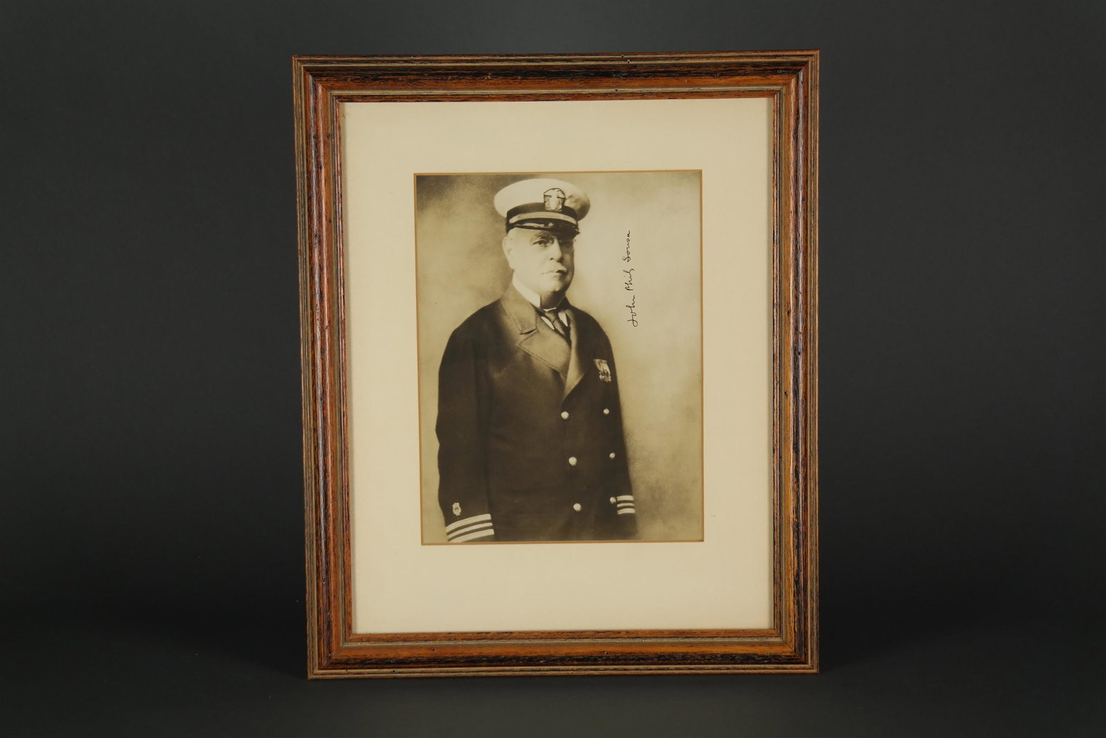 John Philip Sousa. Signed Photograph.: [Autograph] Sousa, John Phillip (1854-1932). American composer and conductor. Signed Photograph, sepia, approx. 9 ½ x 7, signed vertically. Framed 16" x 13"._x000D_ Condition Sight condition ve