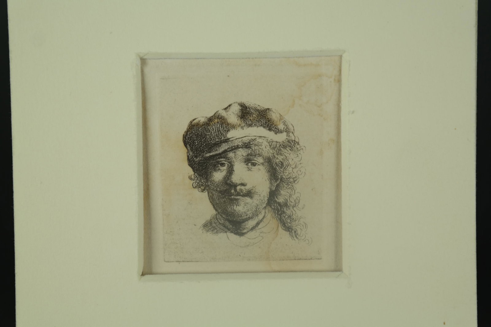 After Rembrandt. Self-portrait. ca. 18th c.: [Prints] After Rembrandt van Rijn (Dutch, 1606-1669). "Self Portrait Wearing a Soft Cap." ca. 18th century. Etching on laid paper. Mat: 6 1/16" x 4 3/4". Sheet: 2 7/16" x 2 3/16". Plate: 2 5/16" x 1 7