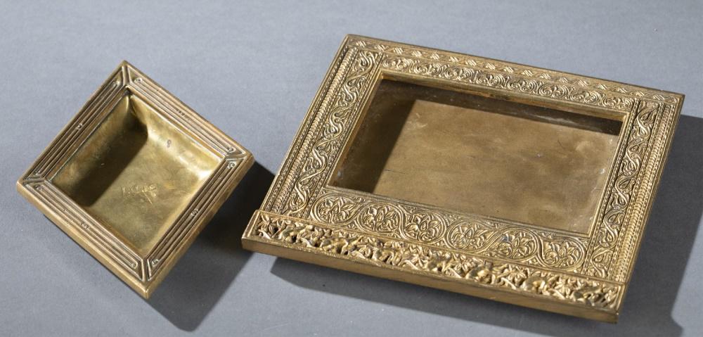 2 Tiffany Studios, gilt bronze desk accessories.: A group of two Tiffany Studios gilt bronze desk accessories. Late 19th/Early 20th century. ++ Calendar frame in "Venetian" pattern. Geometric scrolling around frame with frieze of animals on bottom. M