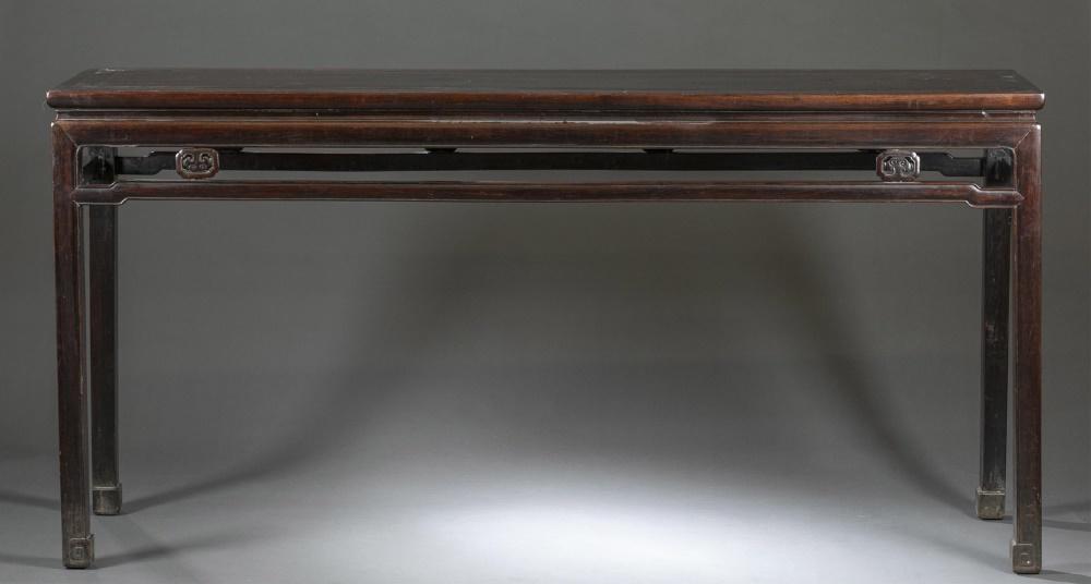 Chinese hardwood altar table, 19th century.: A Chinese hardwood altar table. 19th century. Rectangular table top on straight legs and feet carved with swirl motif, having carved open work apron. 73" x 20" x 35 1/2"._x000D_ Condition: Requires th