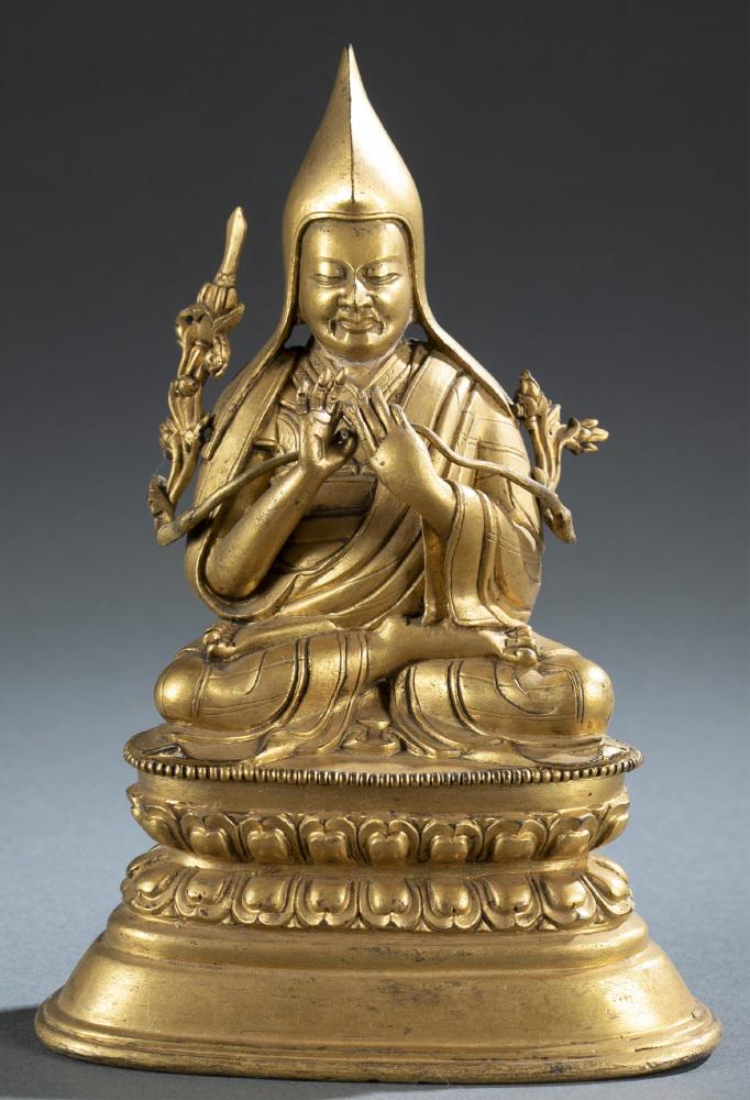 Chinese Tibetan gilt seated Buddha statue.: A Chinese Tibetan gilt seated Buddha statue. Tsongkhapa in robe, seated on Padmasana/lotus throne, with his hands in the gesture of Dharmacakrapravartana Mudra. Harmer Rooke Galleries stick to the bot