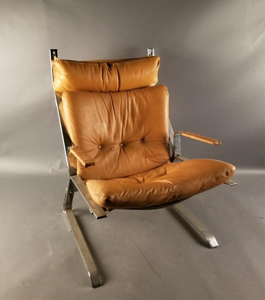 Elsa & Nordahl Solheim, "Pirate", chair.: Attributed Elsa & Nordahl Solheim, Norwegian Modern, leather and chrome "Pirate" lounge chair for Rykkin. Flat bar chrome construction with brown leather. Wear on leather consistent with age and use. 