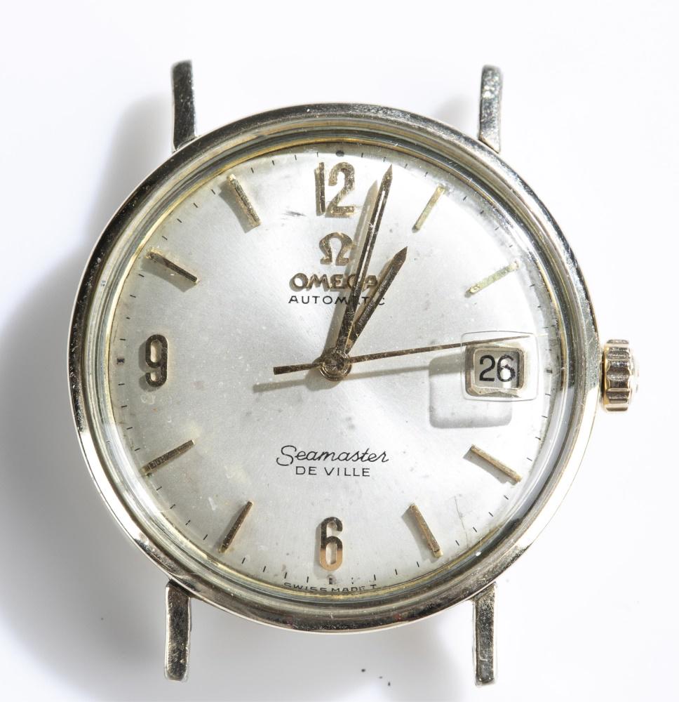 Omega Automatic 14k Seamaster De Ville watch face: An Omega Automatic Seamaster De Ville watch face, 1960s-70s. 14k gold filled case. Marked on face "Omega". Watch in working order. Diameter 1 1/2''.