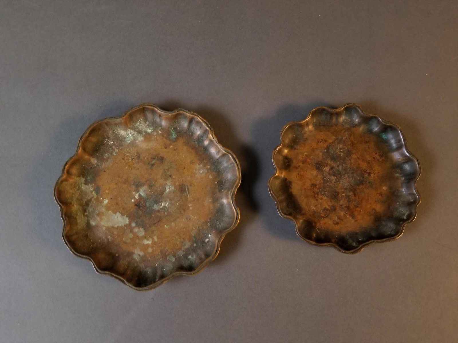 Two Tiffany Studios Brass Trays, #1719: Two Tiffany Studios Brass Trays, #1719 ++ Heavy patina from use on both ++ Marked on both "Tiffany Studios New York 1719" ++ 5" and 4" in diameter