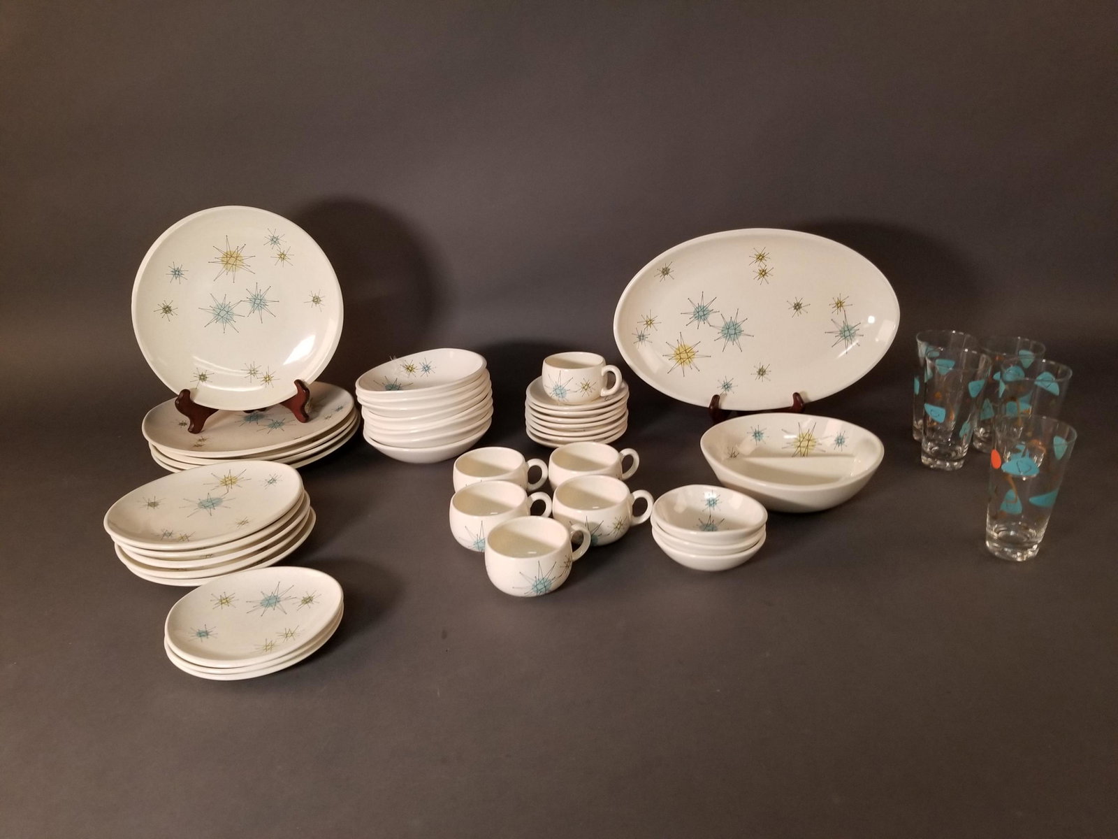 Vintage Franciscan "Starburst" China Service: Vintage Franciscan "Starburst" China Service,1954 - 1966, 44 pieces and five water glasses ++ 5 dinner plates, 5 salad plates, 3 bread plates, 1 platter, 6 tea cups, & seven saucers, 8 bowls, 3 small 