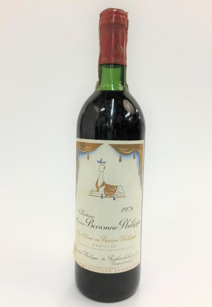 1978 Chateau Mouton Baron Philippe Cru ClassÃ©.: A bottle of 1978 Chateau Mouton Baron Philippe Cru ClassÃ©, Pauillac, France, 750ml._x000D_ Condition: Abrasions, tears, and discoloration to label. Some accretions to bottle.