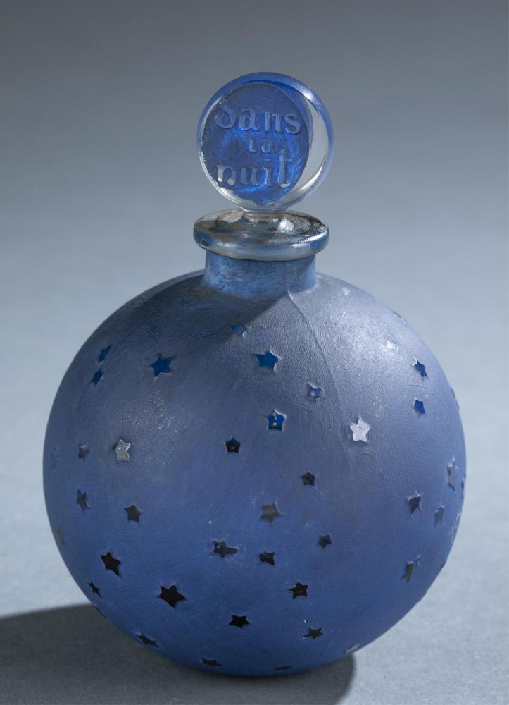 R. Lalique, "Dans la Nuit", perfume bottle.: Rene Lalique (French, 1860-1945) for House of Worth "Dans la Nuit" factice perfume bottle. Clear glass bottle and stopper painted blue enamel stenciled stars. Stopper marked "dans la nuit." Labeled on