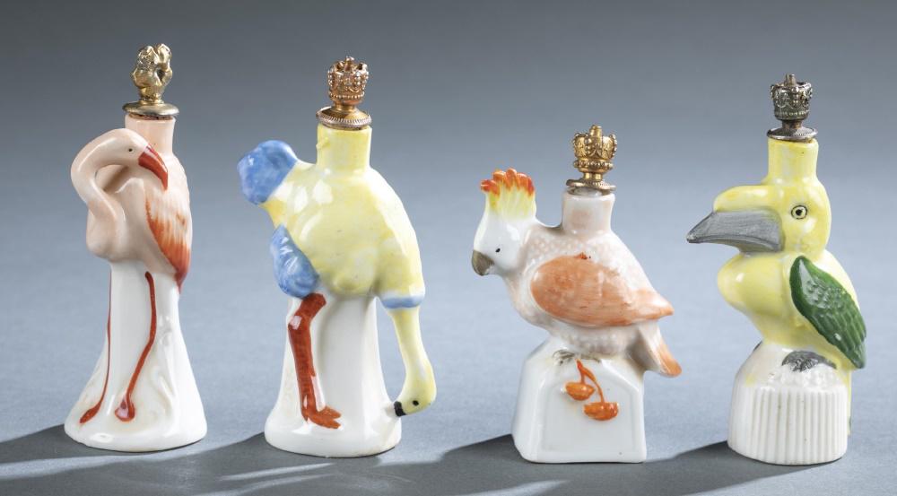 4 Schafer & Vater porcelain, perfume bottles.: A group of four Schafer & Vater porcelain crown top perfume bottles. Circa 1930s. Topped with metal shaped crown with cork. Marked on bottom in red "Germany". ++ Ostrich. Marked near leg "7986". ++ Fl