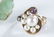 3 Gold rings and 1 brooch. - 2