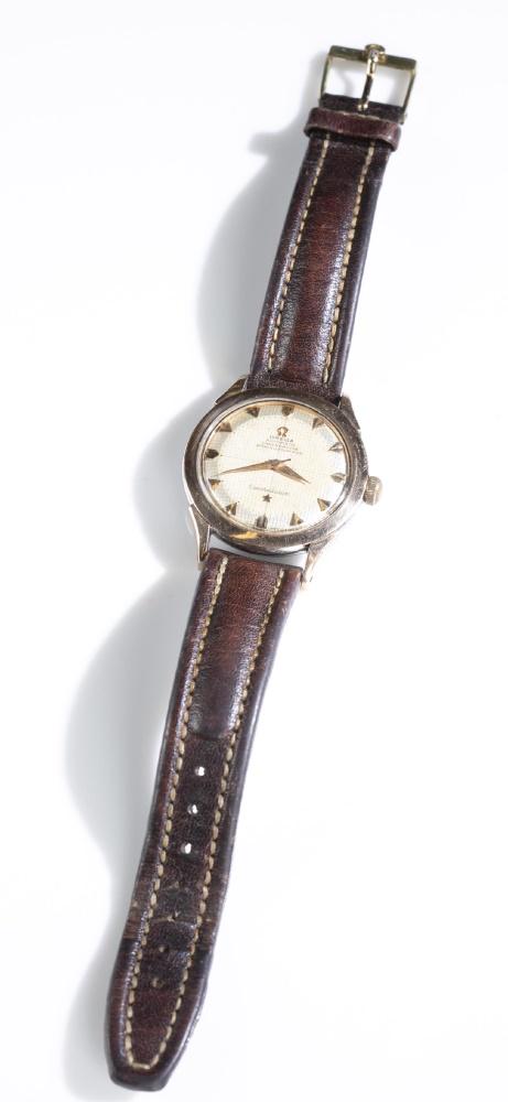 Omega Constellation Automatic Wristwatch: An Omega Constellation Automatic Chronometer wristwatch. Round face with stainless steel and gold case. Band made of leather. Watch in working order. Closed 3 3/4'' and open 9''.