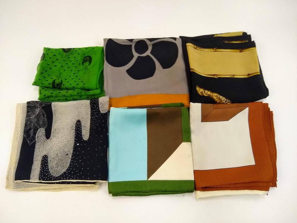 6 Silk and Silk Blend, Designer Scarves.: A group of six silk and silk blend scarves. Includes three Hanae Mori, one Jacques Fath, one Roberta di Camerino, and one Mark Cross. Some have areas of staining. Long scarf:, Approx: 59" x 16". The