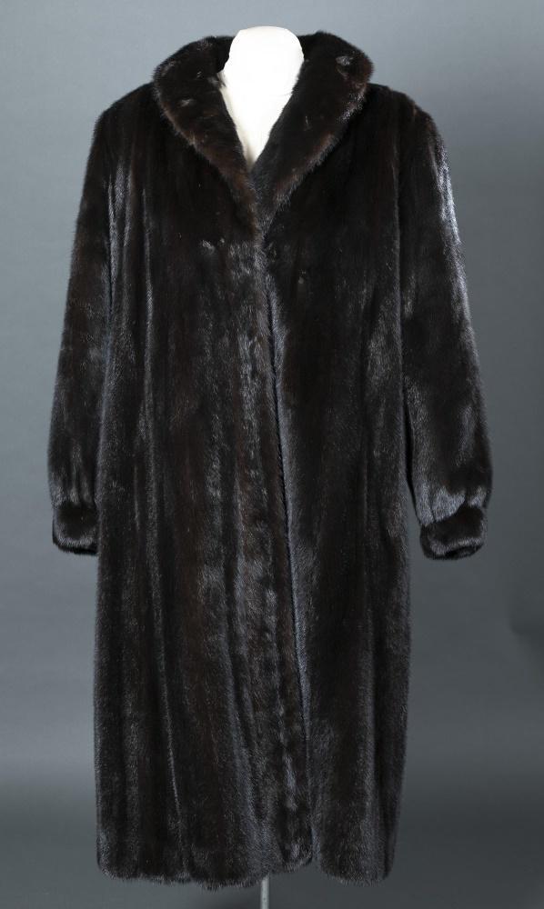 Brown Mink Fur, Gartenhaus, Coat.: A brown mink fur Gartenhaus coat having two pockets, one buton, and three fasteners. Silk lining with personal embroidery. Label reads Gartenhaus. Tear in seem near fasteners. Bust: Approx, 50". Lengt