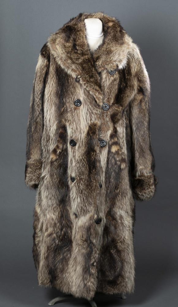 Raccoon Fur, St. Paul's, Coat.: A Racoon fur coat by St. Pauls's Fur Coat. Double breasted coat with two pockets. Silk and tweed lining. Label reads "St. Paul's Fur Coat." Chest: Approx, 50". Length: Approx, 55".