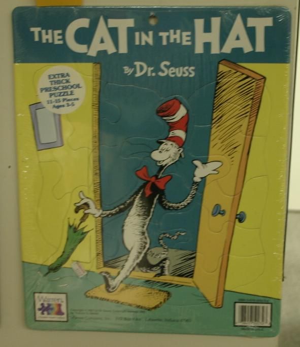 Dr. Seuss/Ephemera. Puzzle. The Cat In The Hat.: Dr. Seuss/Ephemera. Puzzle. The Cat In The Hat. Illustrated by Dr. Seuss. Lafayette, IN: Warren Co., 1985. 11 1/8 x 14 inches. Illustrated bds, extra thick, unopened in original wrap, price tag and la