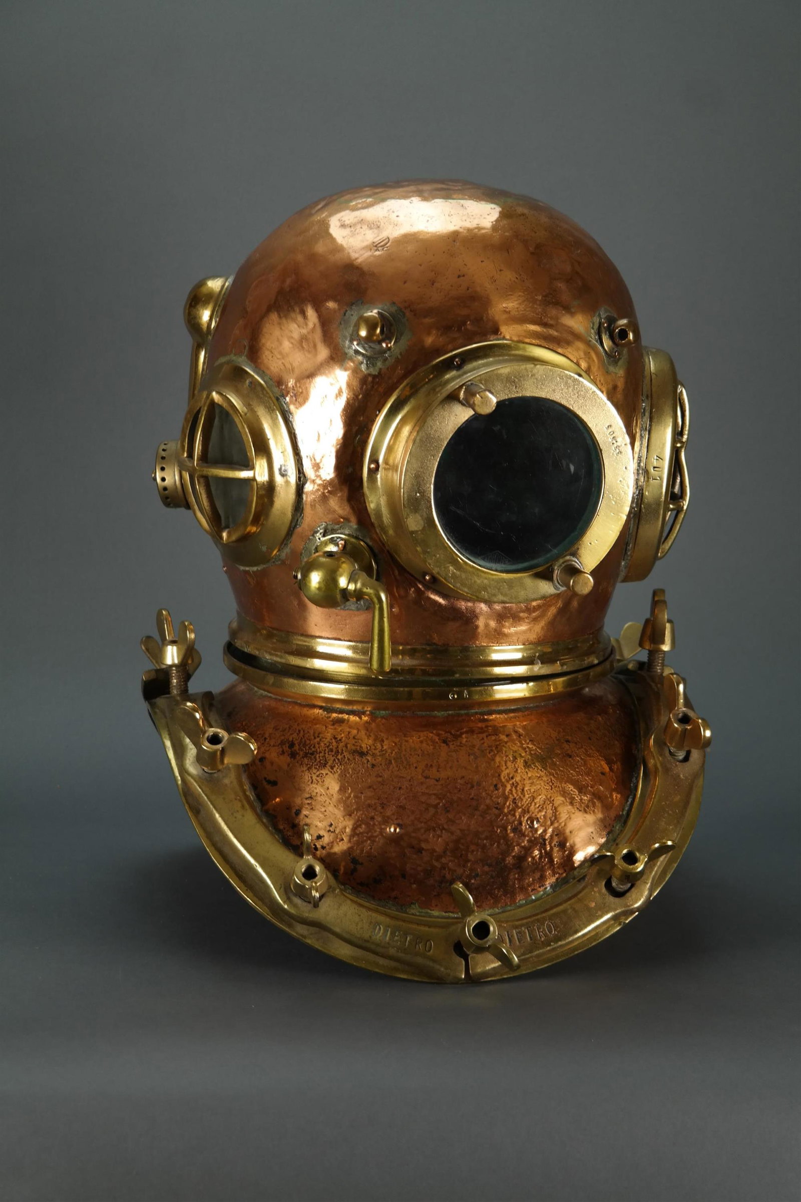 Italian I.A.C. Diving Helmet. 20th c.: [Exploration] Early 20th century Italian I.A.C. Diving Helmet. 21" x 16". Provenance Acquired in La Spezia, Italy in the 1970s. Condition Patina cleaned. Mixed collar pieces. Glass missing from left s