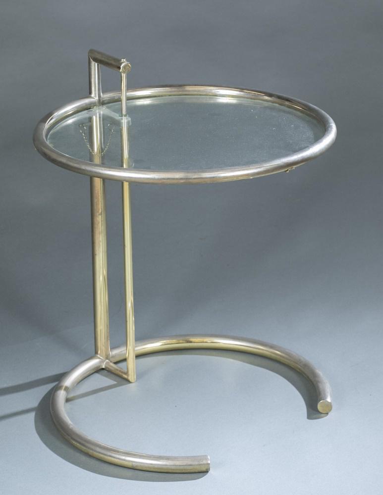 Eileen Gray, "E1027", occasional table.: An Eileen Gray (Irish, 1878-1976) "E 1027" occasional table. Glass and chrome plated steel. Adjustable round glass top table. Marked " BS2 25773." Chip to glass top. Wear to to chrome throughout consi