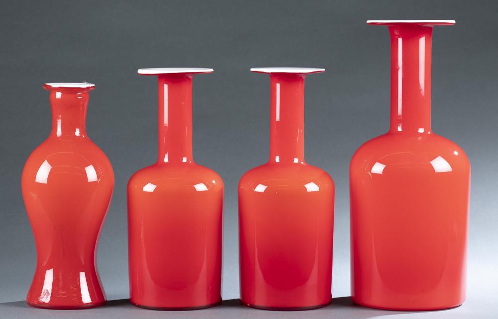 4 Kastrup-Holmegaard Gulvvase vases.: A group of four Kastrup-Holmegaard Gulvvase vases by Otto Brauer. 1960's. Denmark. Red glass with white interior casing. Paper label on 3 of 4. Each has residue on body. Biggest: 14" x 61/2". Smallest