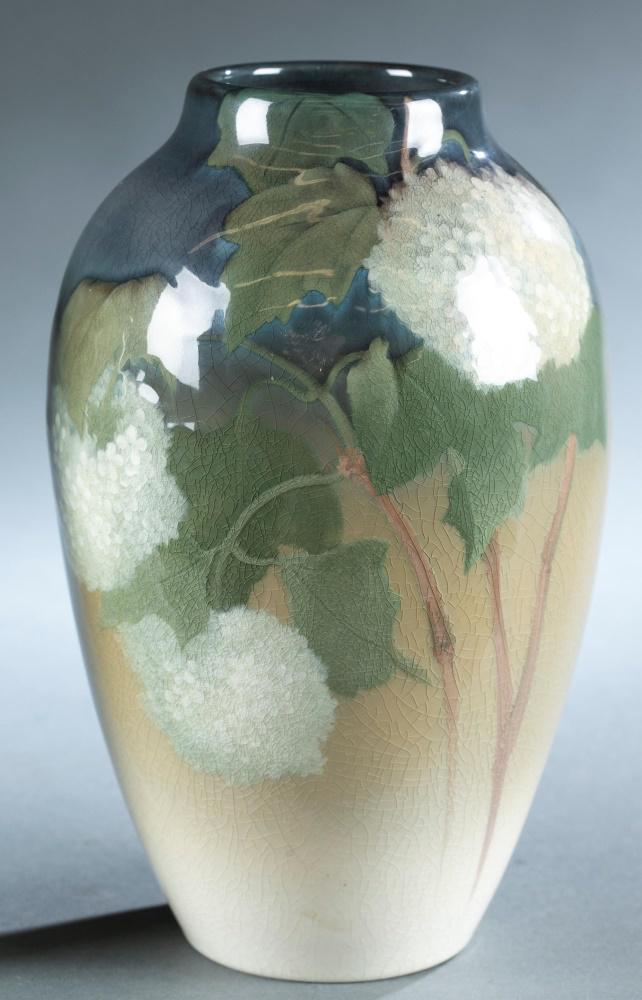 Rookwood, Sara Sax, Iris glaze vase, c. 1902.: A Rookwood Pottery vase by Sara Sax (American, 1870-1949). Circa 1902. Cincinnati, Ohio. Ovoid shape with white hydrangea with blue and green glaze. Shape 900B. Marked, dated, and signed on bottom. 9