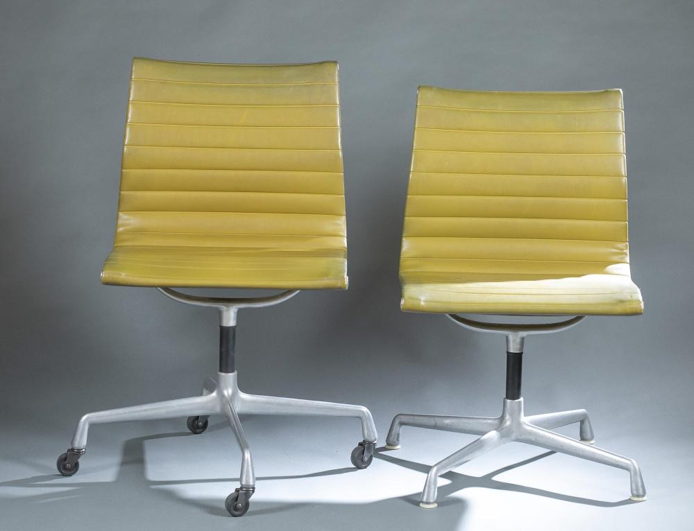 2 Eames for Herman Miller "EAG" chairs.: A group of two Charles and Ray Eames for Herman Miller "EAG" chairs. Zeeland, Michigan. 1960's. Aluminum frame, dark green upholstery, and swivel mechanism. Marked on underside. ++ Side chair with fou